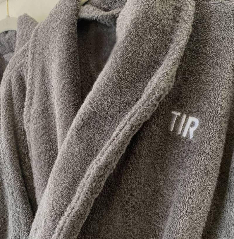 A close up of the initials of the name tir